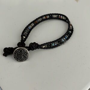 Black beaded rope bracelet with Celtic emblem